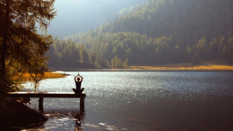 brainlush - brand messaging best practices with pro tips - woman doing yoga by the lake