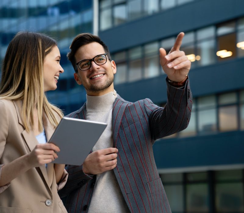 successful business colleagues people working together on digital devices.jpg